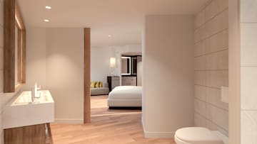 a bedroom with a toilet and a bed