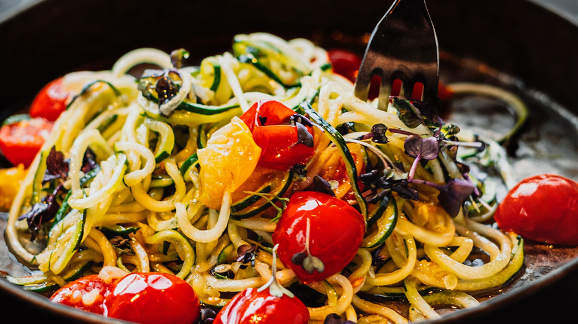 a bowl of food with a fork