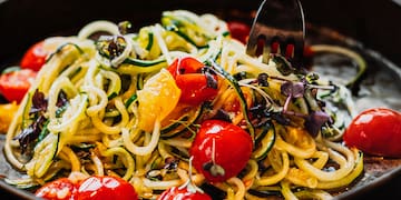 a bowl of food with a fork