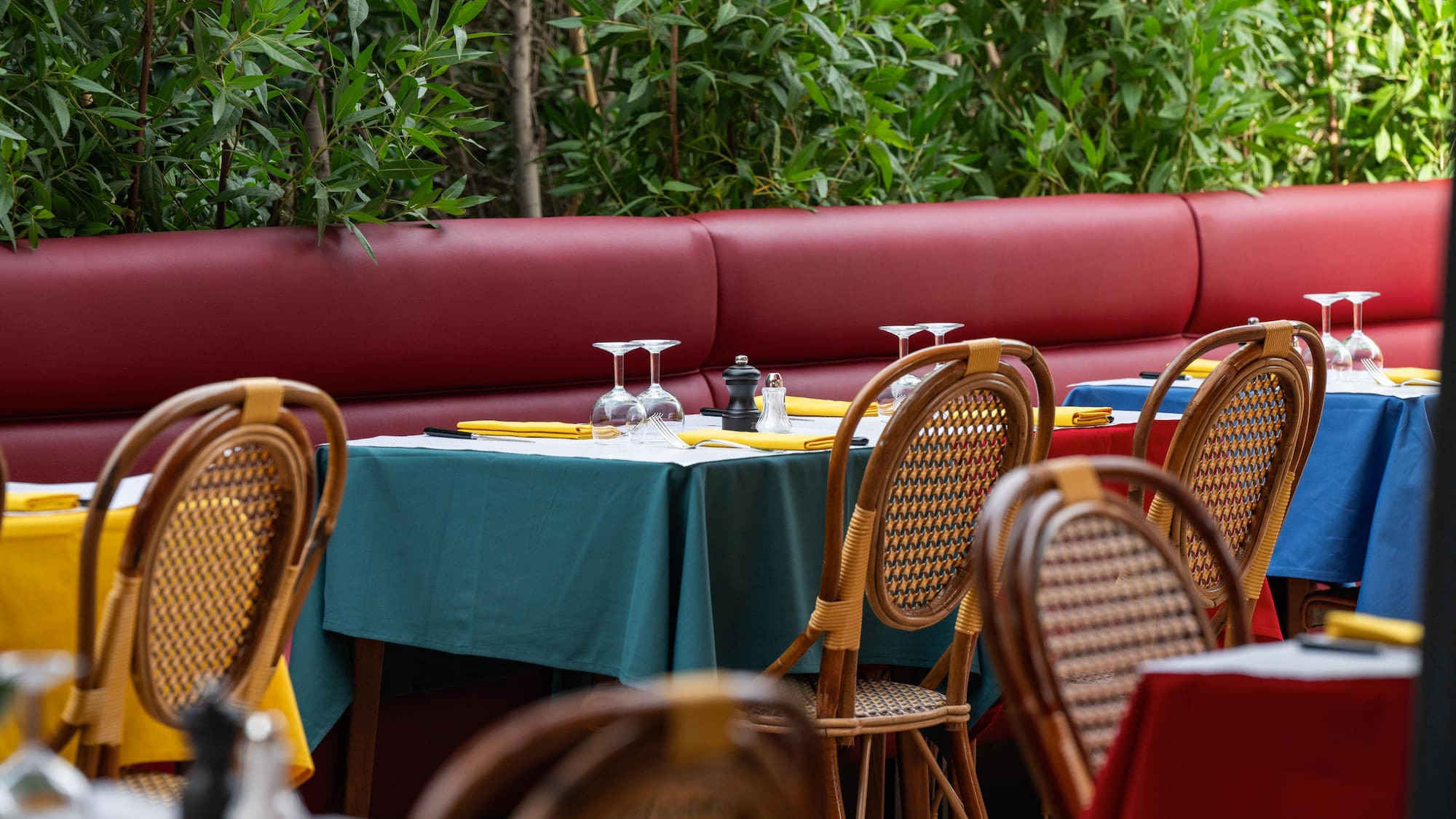 a table with wine glasses and napkins on it