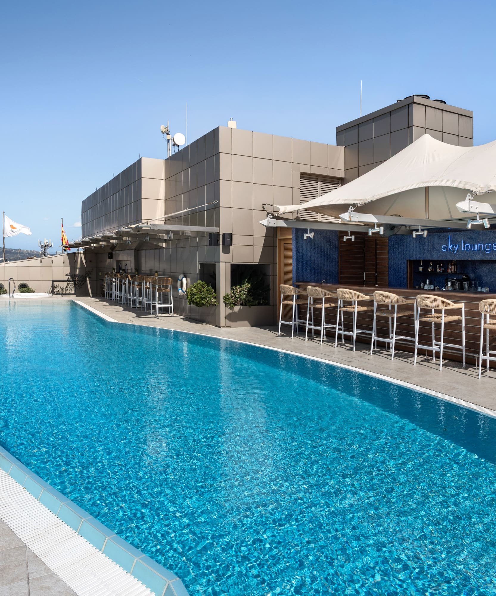 Rooftop swimming pool and Sky Lounge bar with sun loungers and city views.