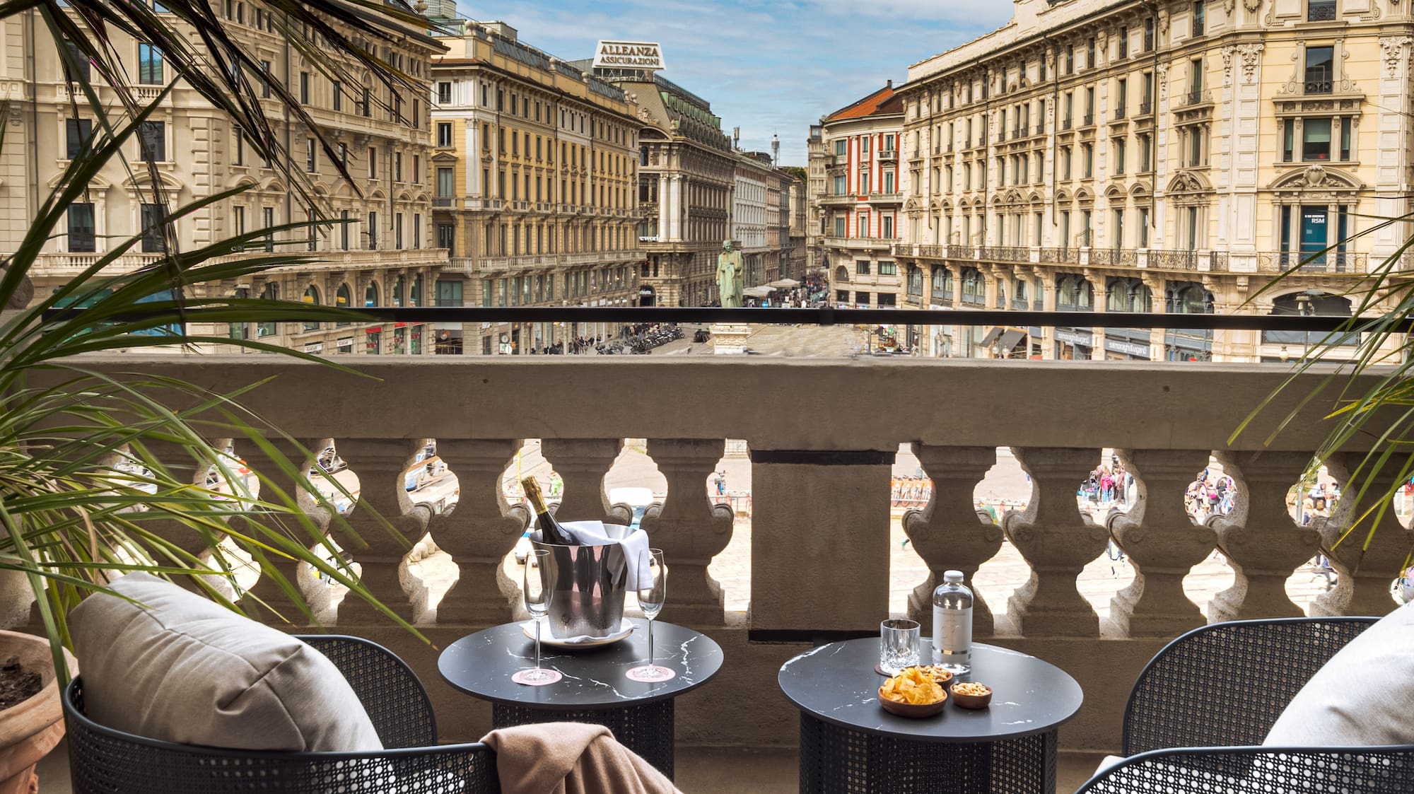 a balcony with chairs and tables