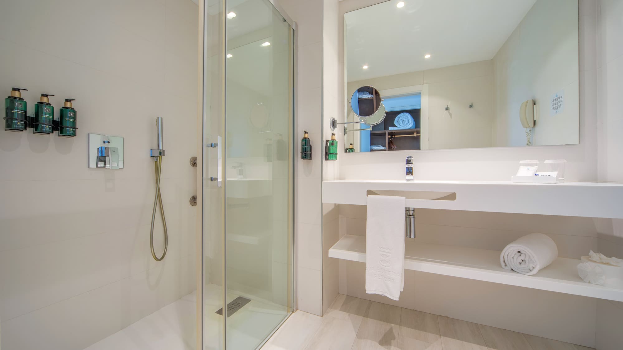 a bathroom with a shower and sink