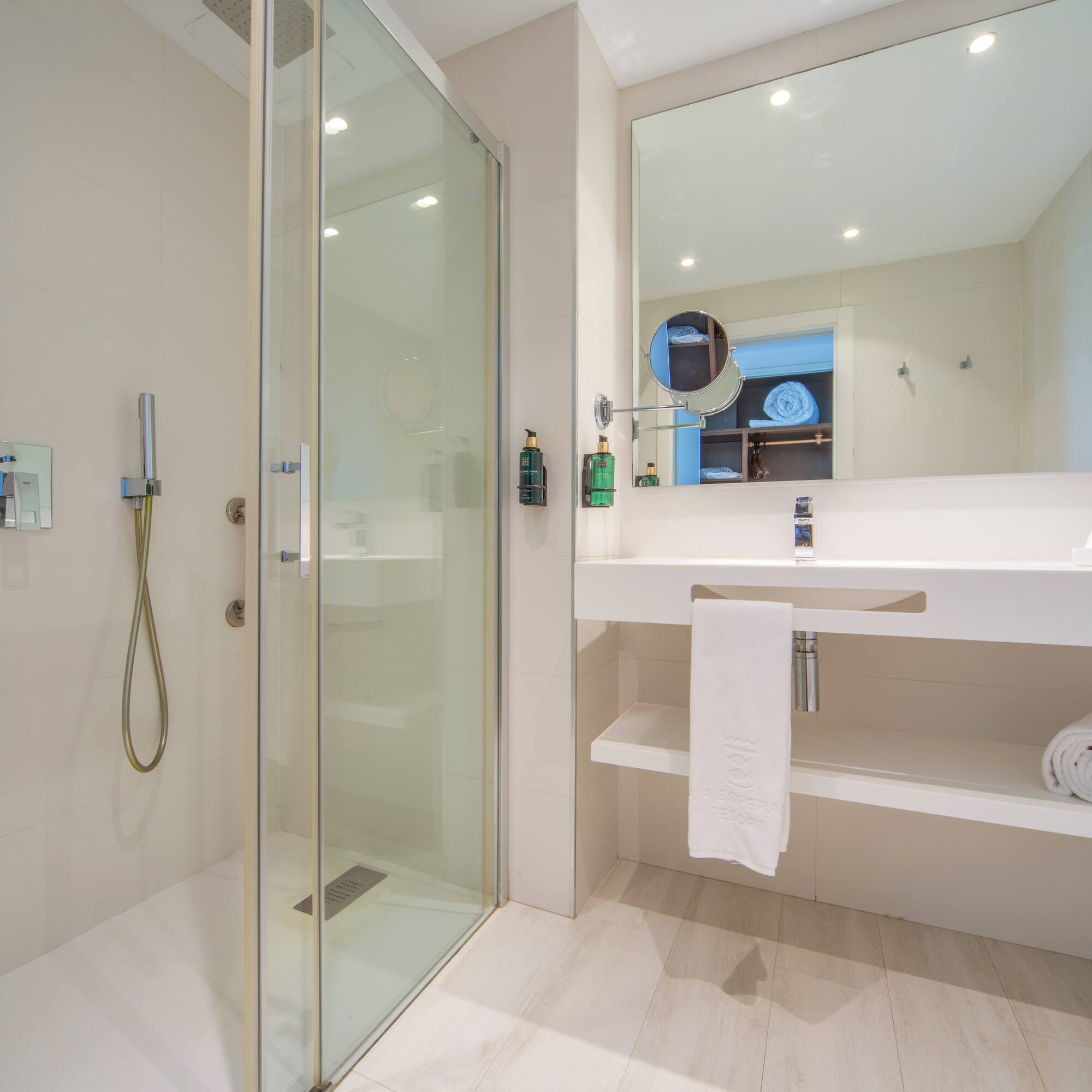 a bathroom with a shower and sink