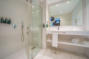 a bathroom with a shower and sink