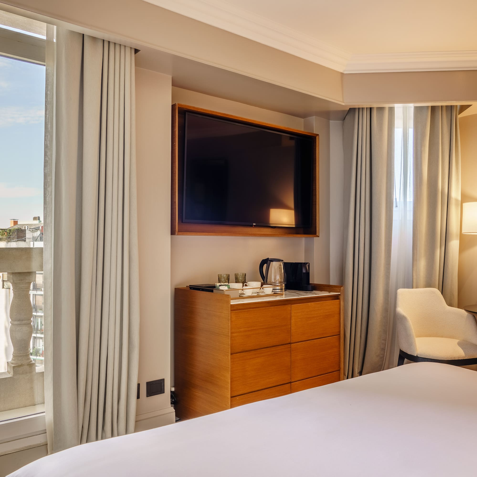 a room with a tv and a dresser