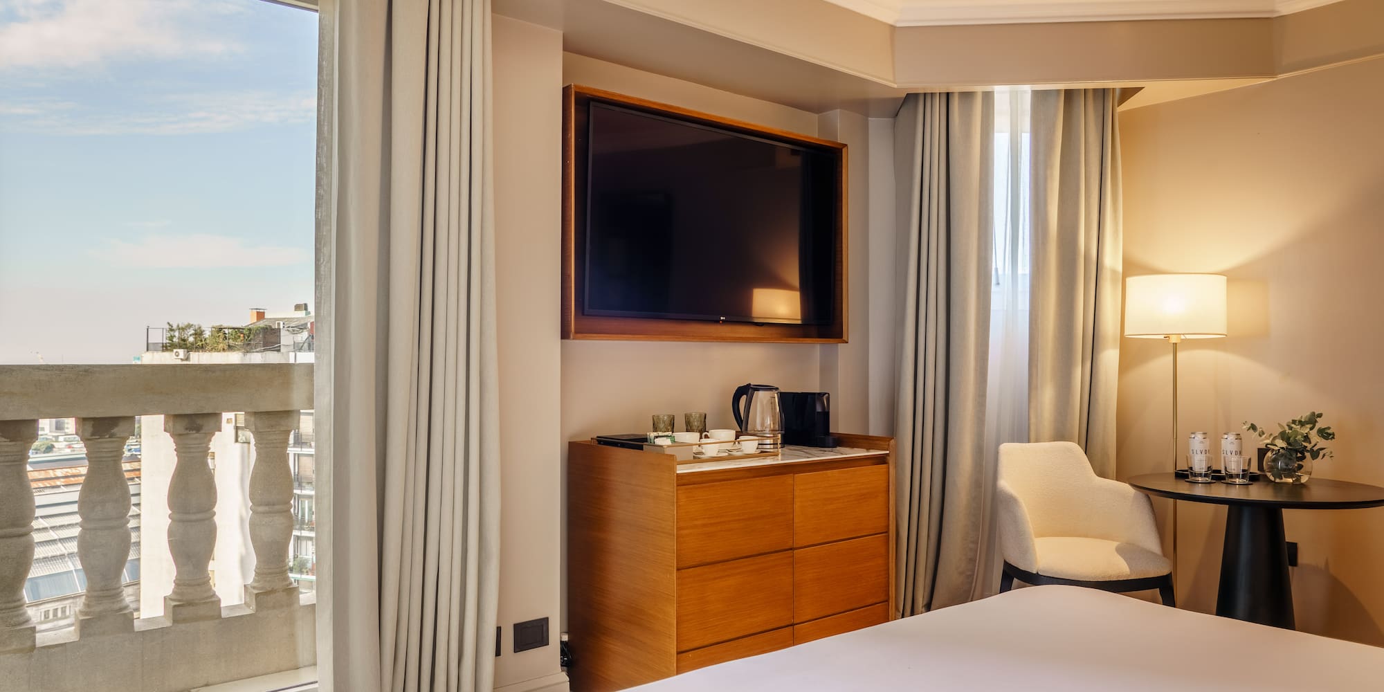 a room with a tv and a dresser