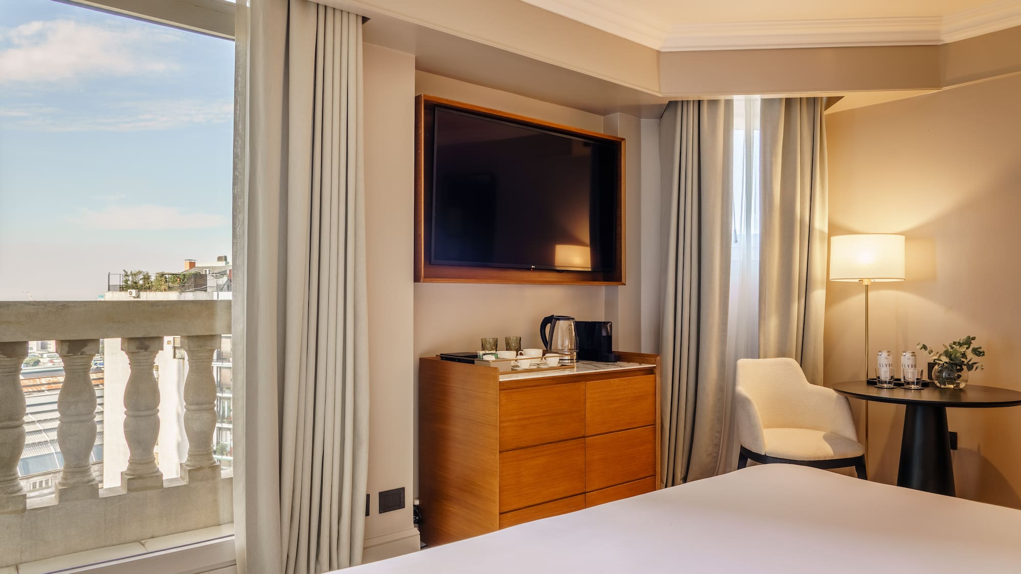 a room with a tv and a dresser