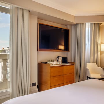 a room with a tv and a dresser