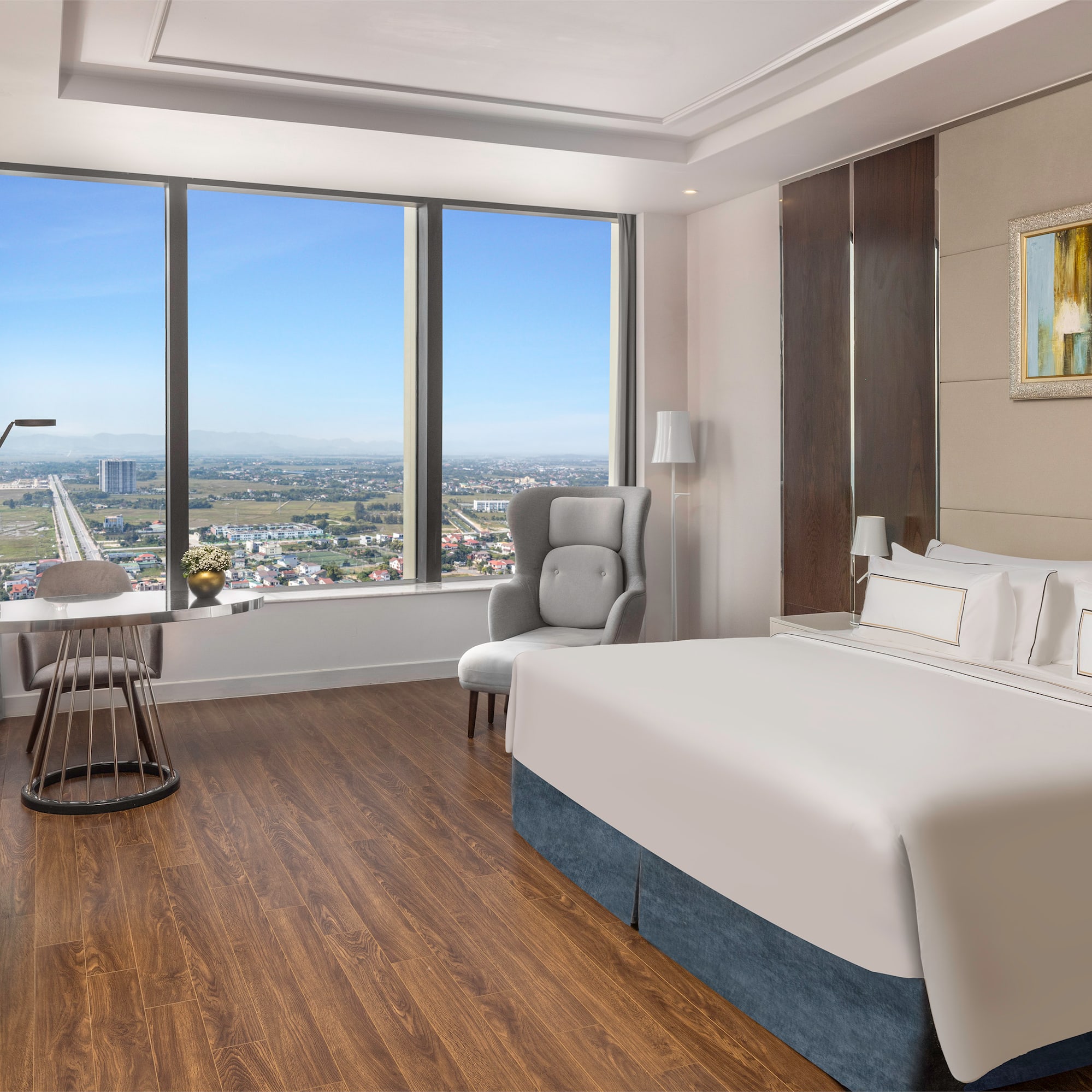 a room with a large window and a bed