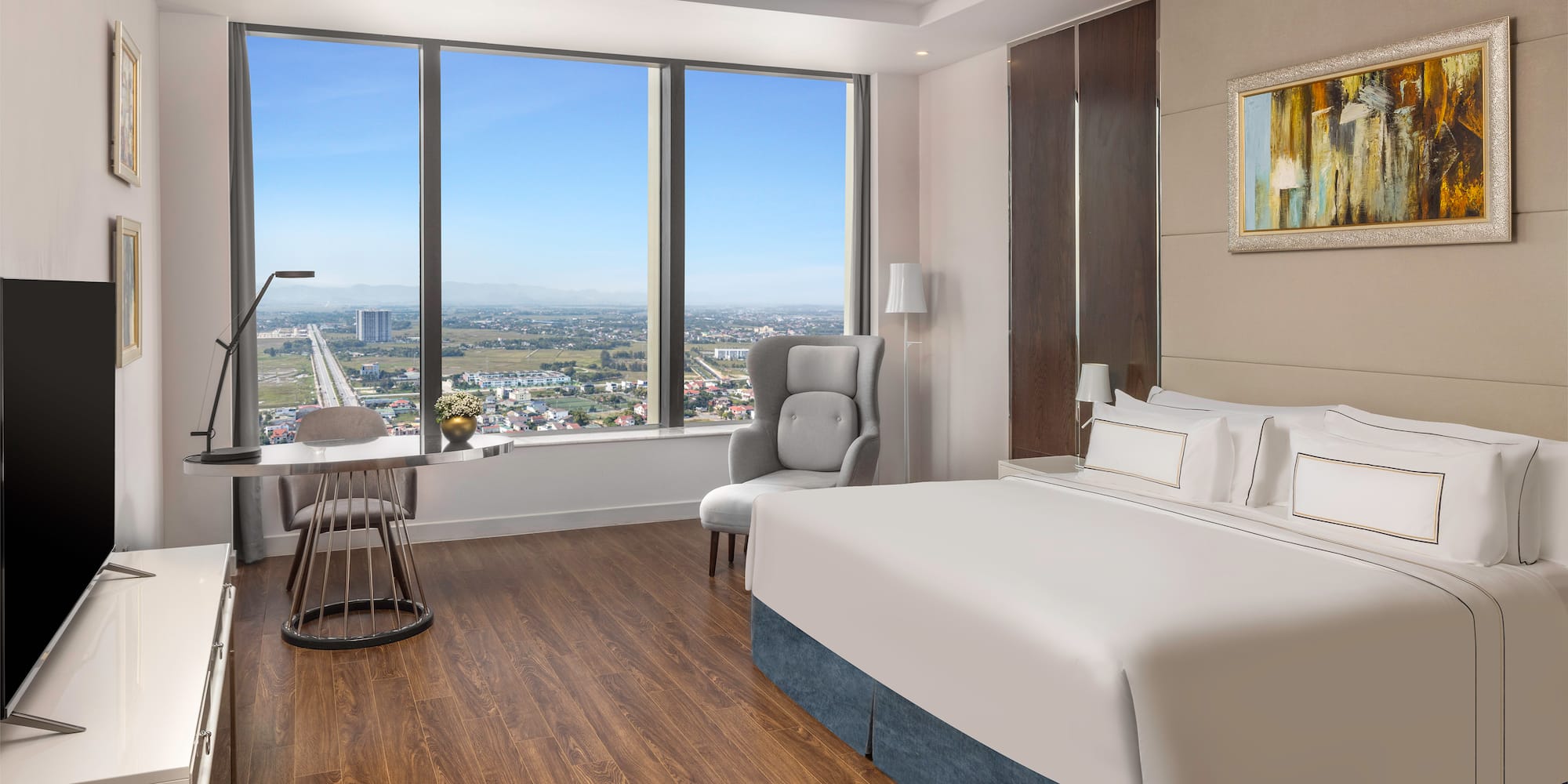 a room with a large window and a bed