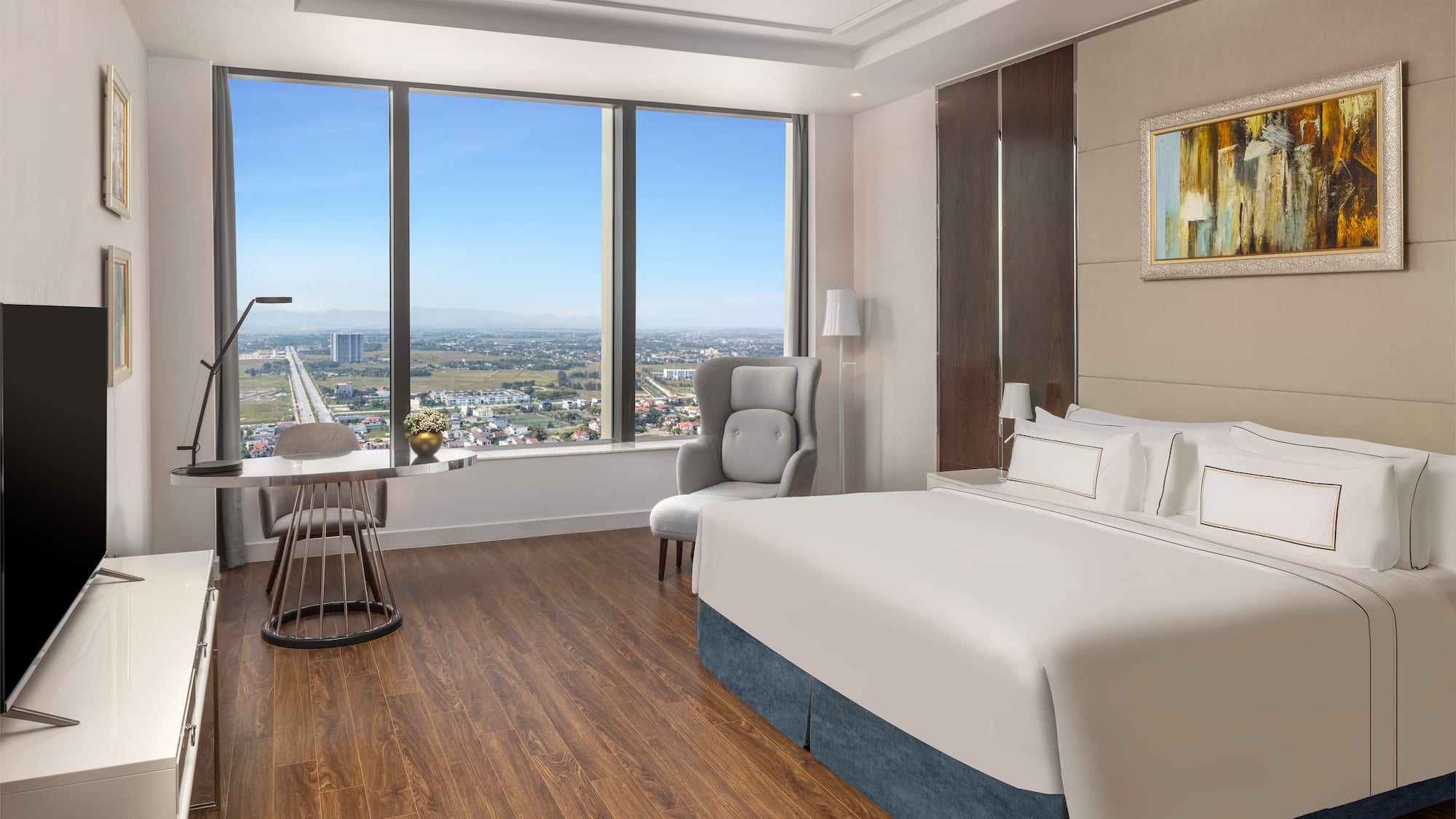 a room with a large window and a bed