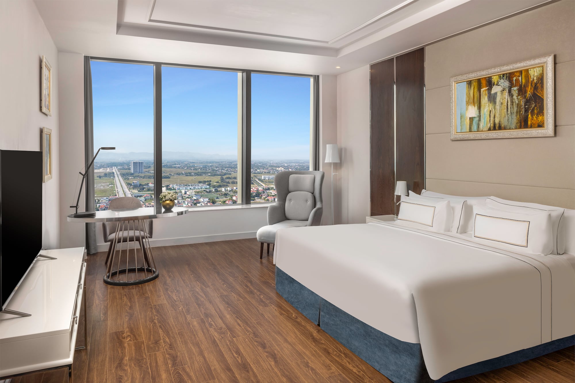 a room with a large window and a bed