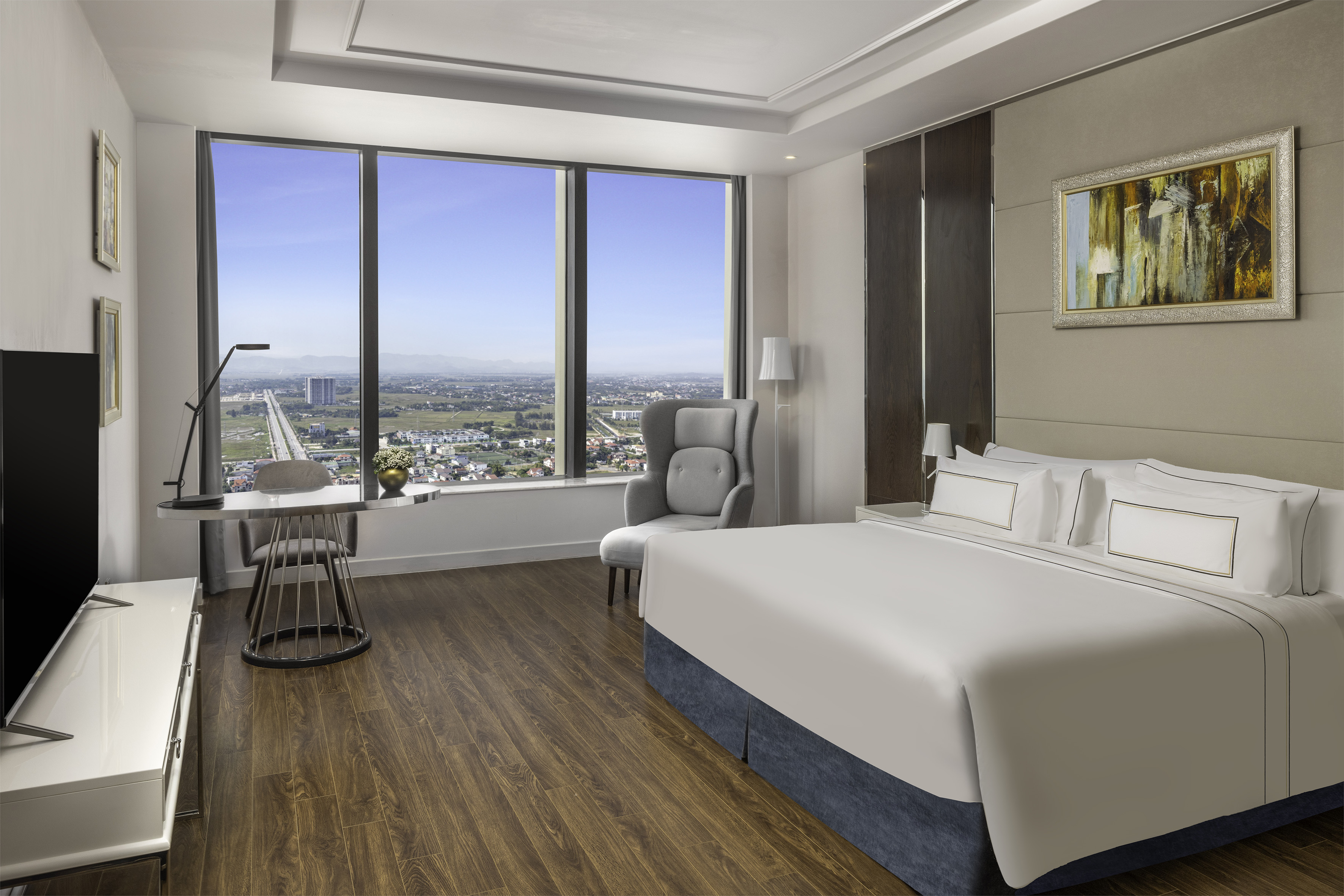 a room with a large window and a bed