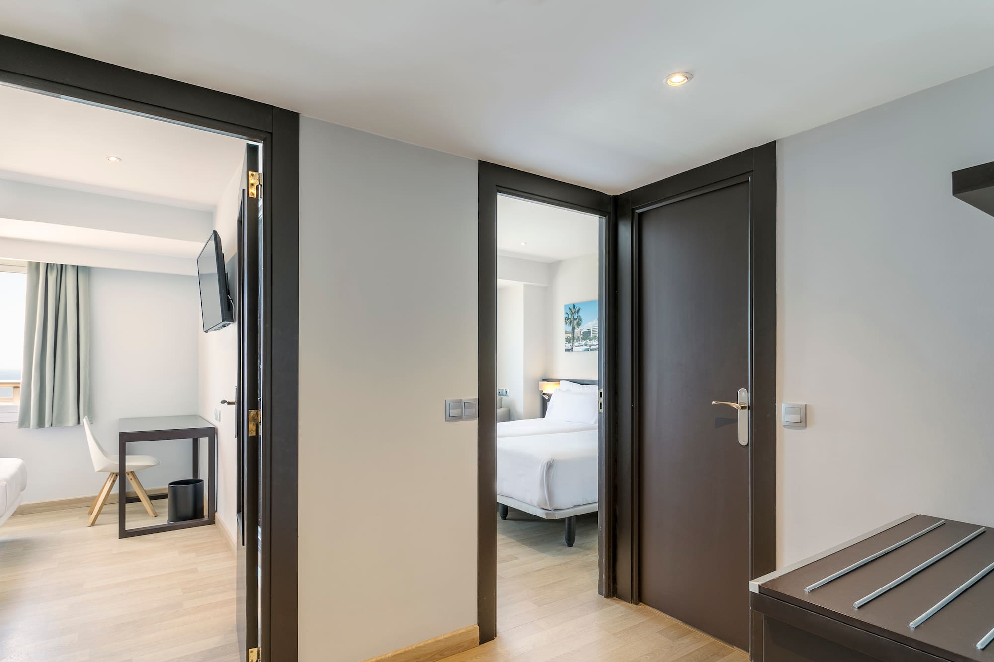 a room with two doors and a bed