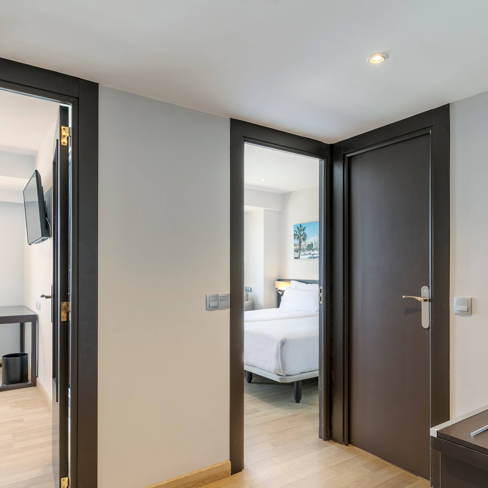 a room with two doors and a bed