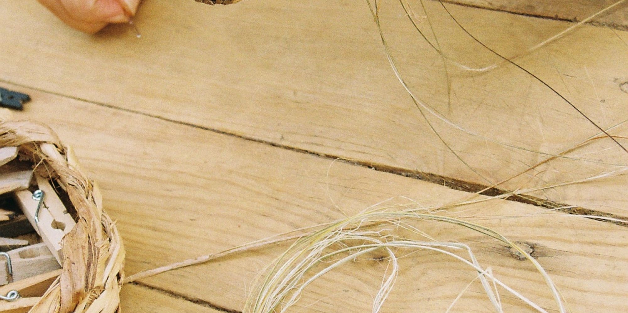 a person holding a woven object