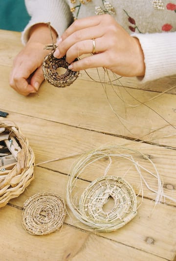 a person holding a woven object