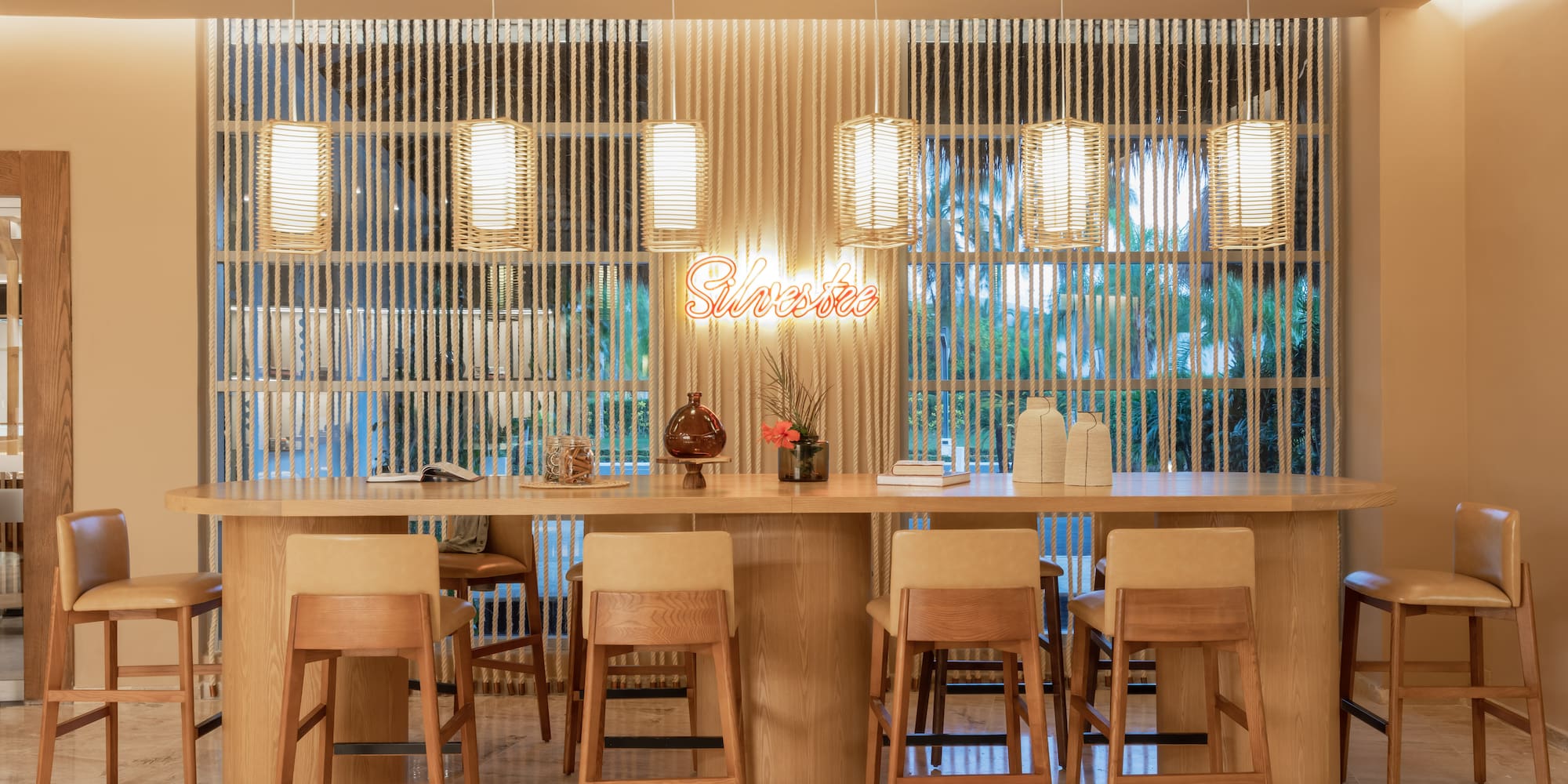 a table with chairs and a table with a sign