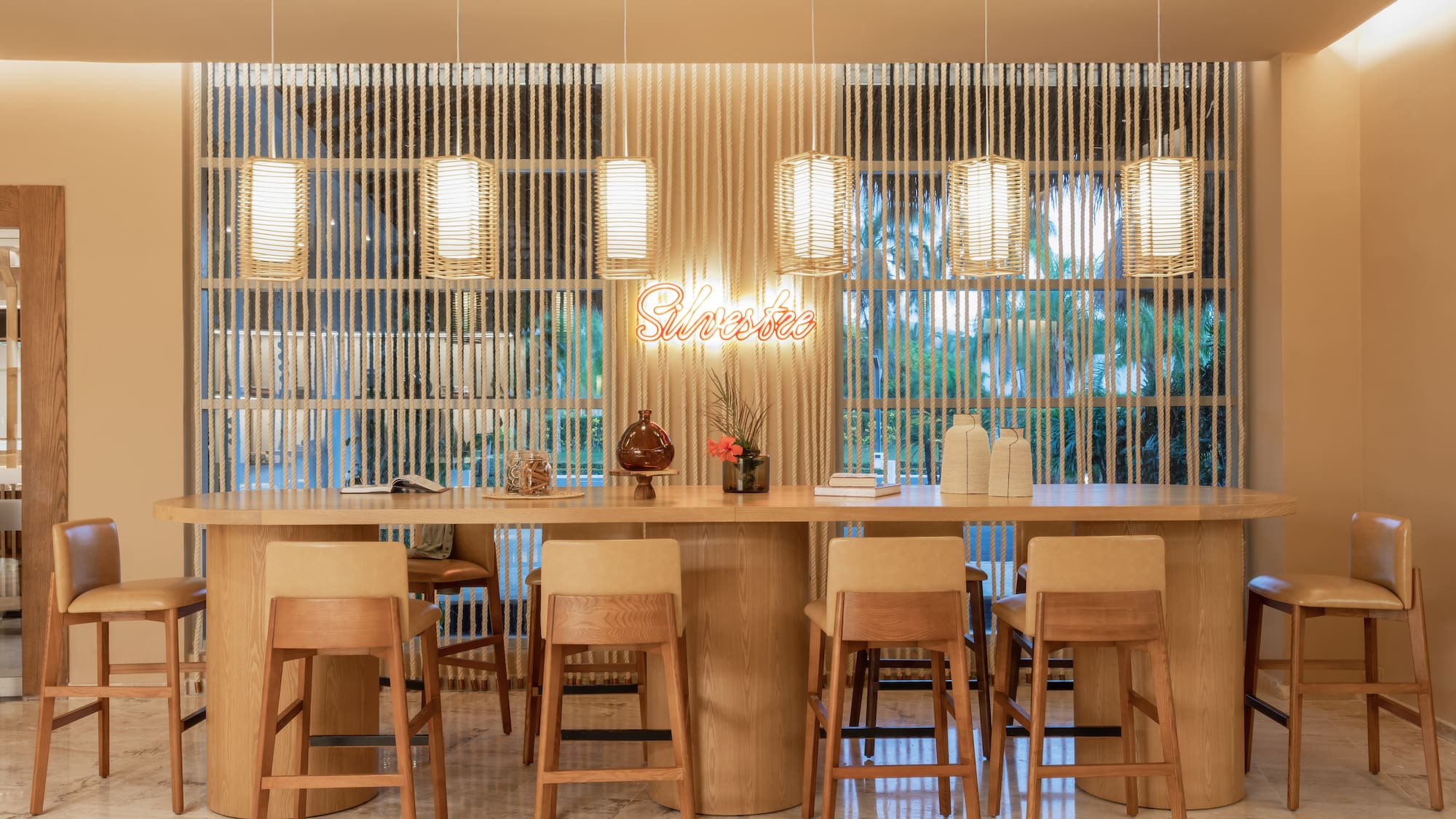 a table with chairs and a table with a sign