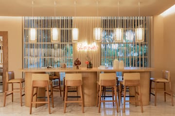 a table with chairs and a table with a sign