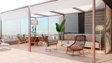 a patio with chairs and a table