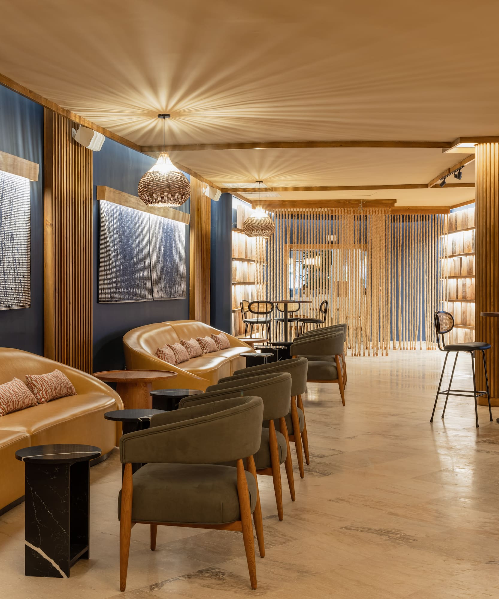 a room with a couch and chairs