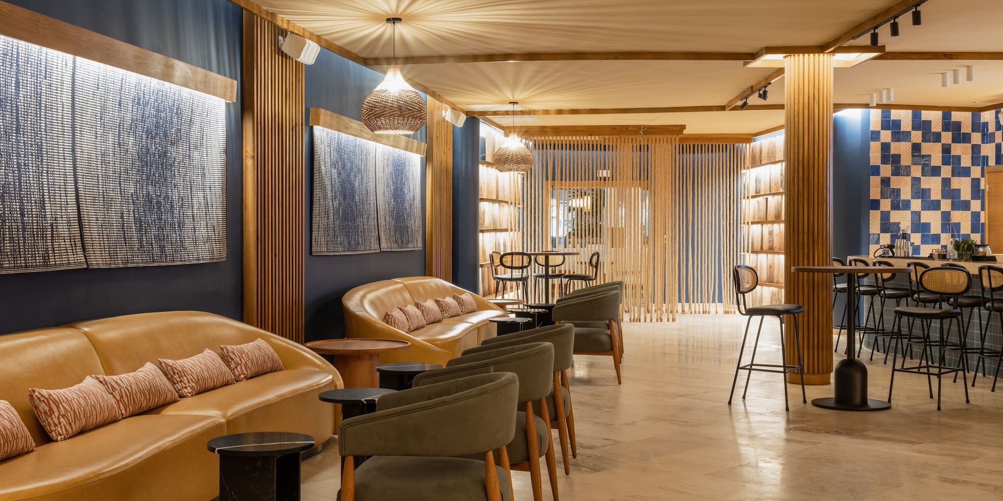 a room with a couch and chairs