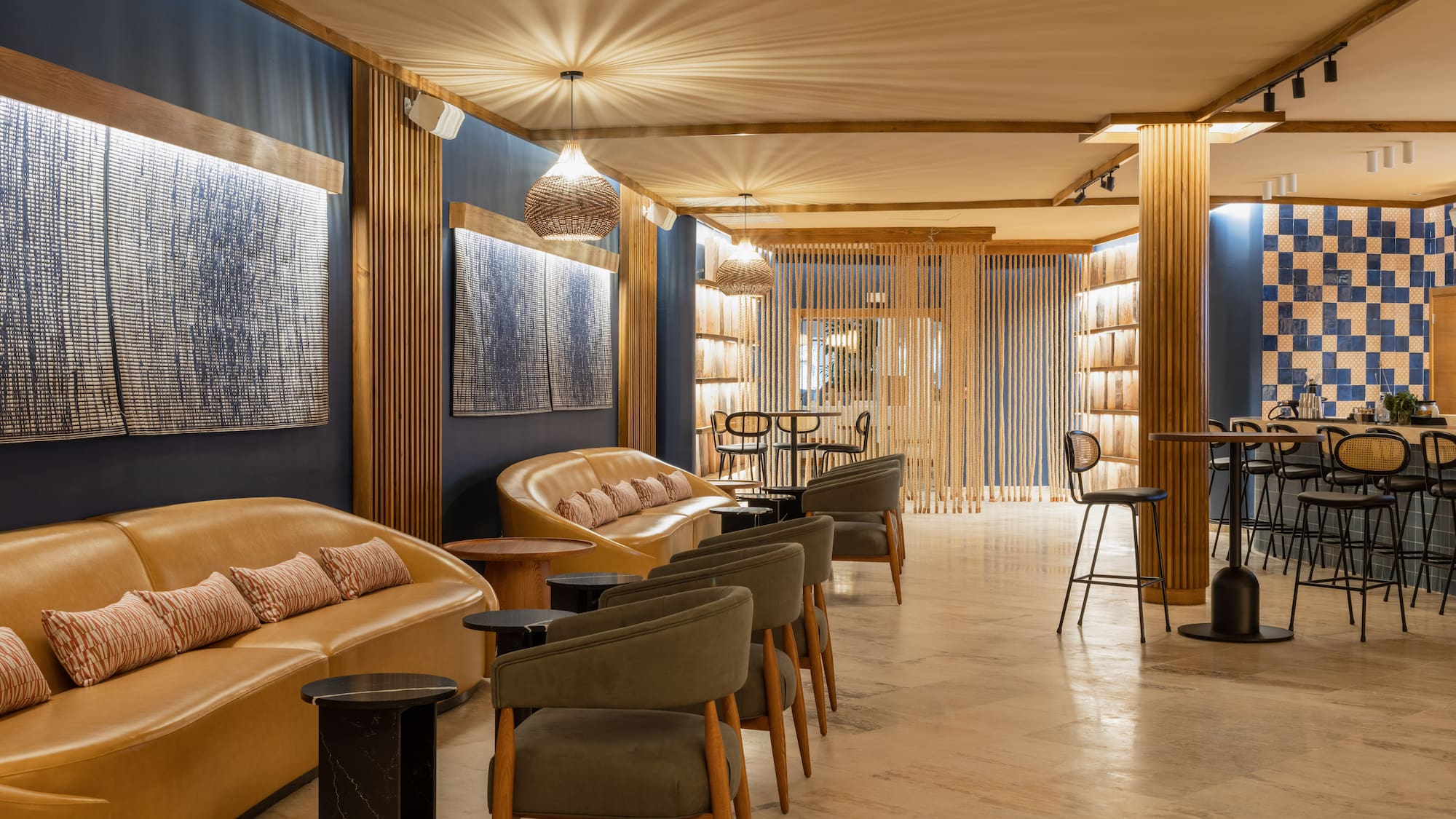 a room with a couch and chairs