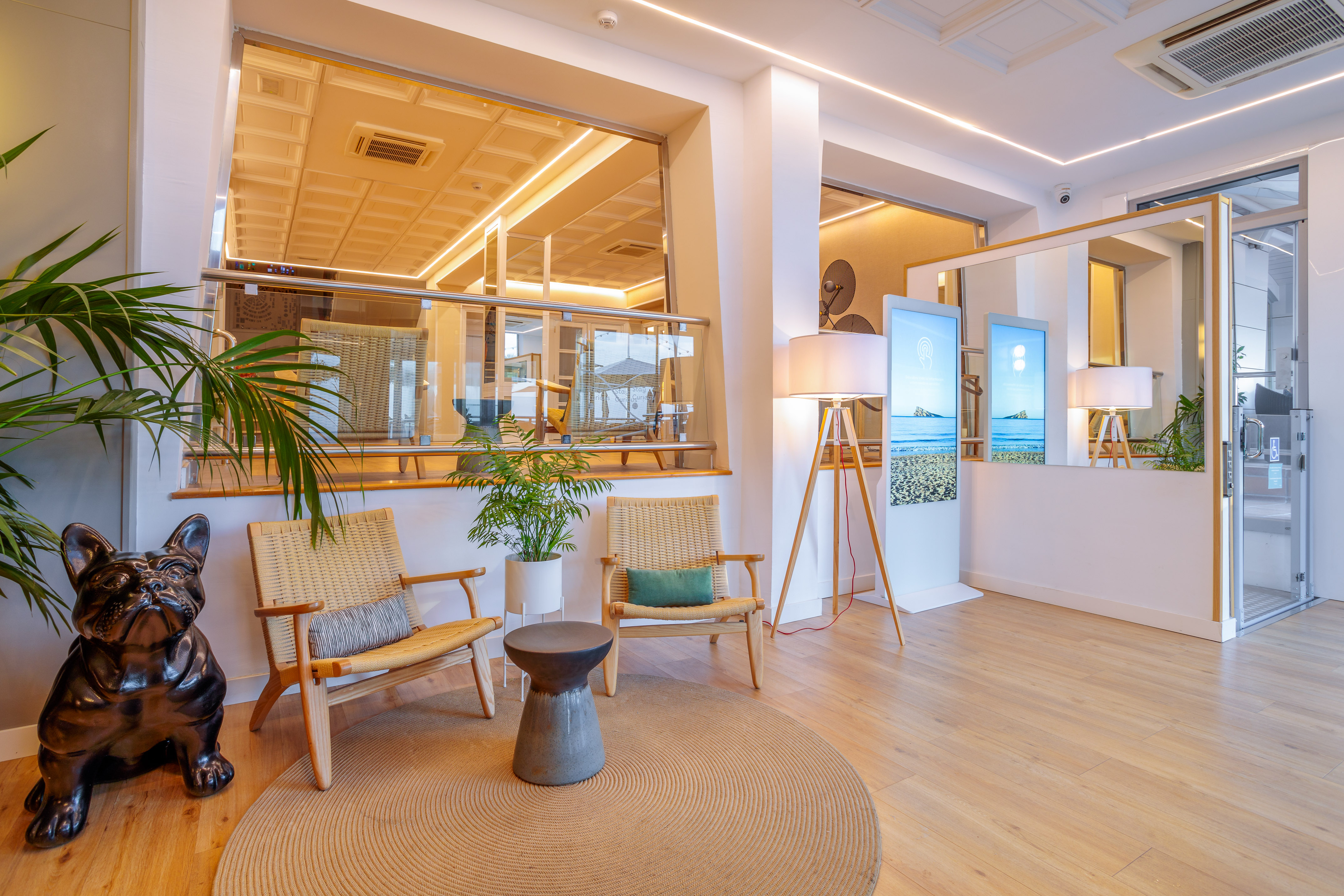 a room with a large window and a large mirror