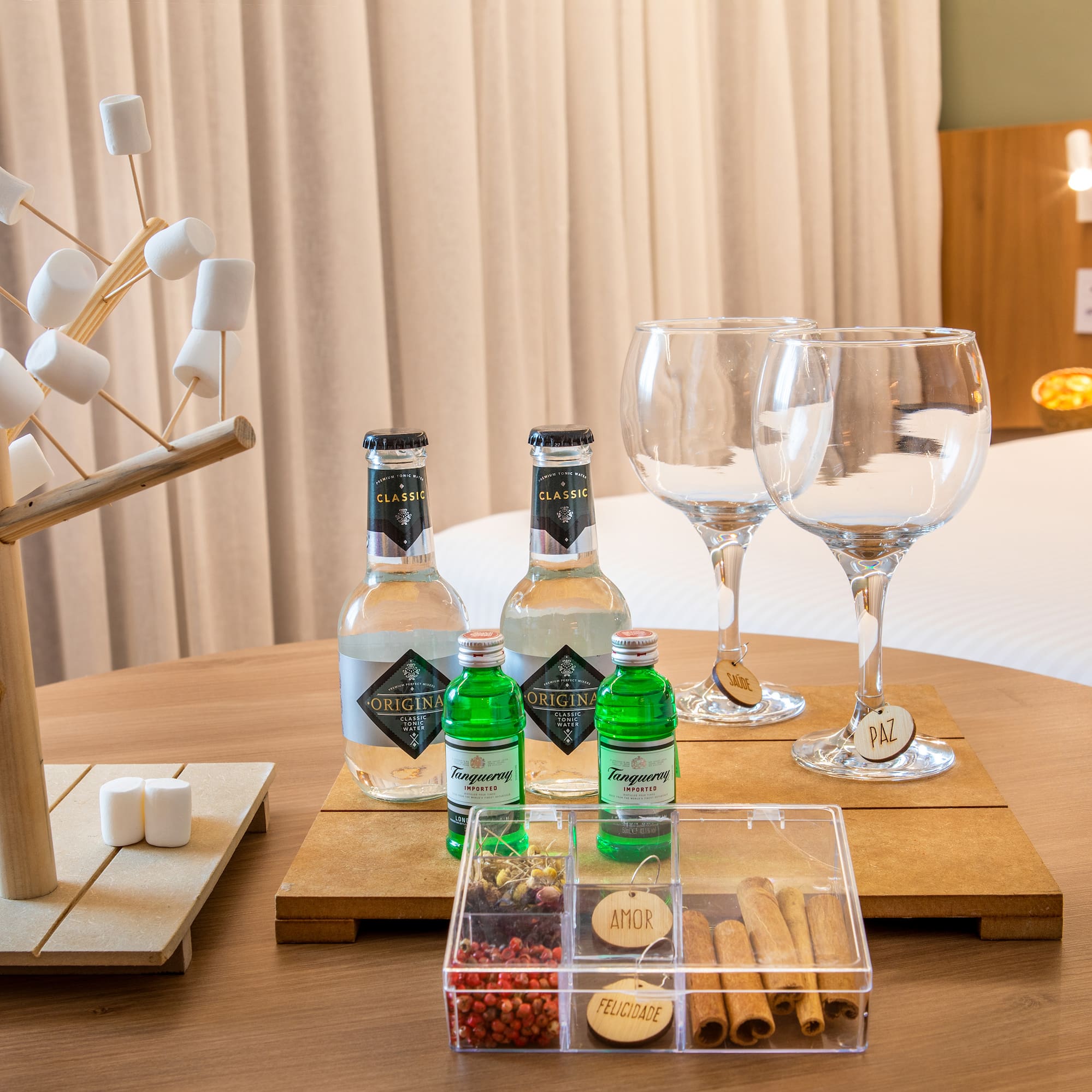 a table with a variety of drinks and glasses