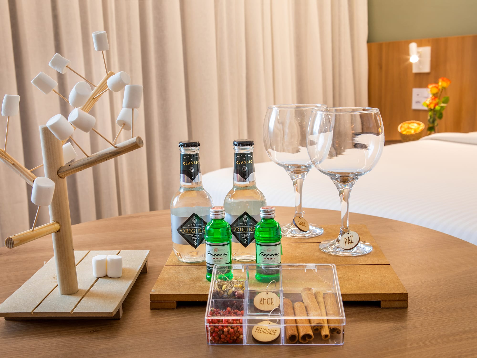 a table with a variety of drinks and glasses