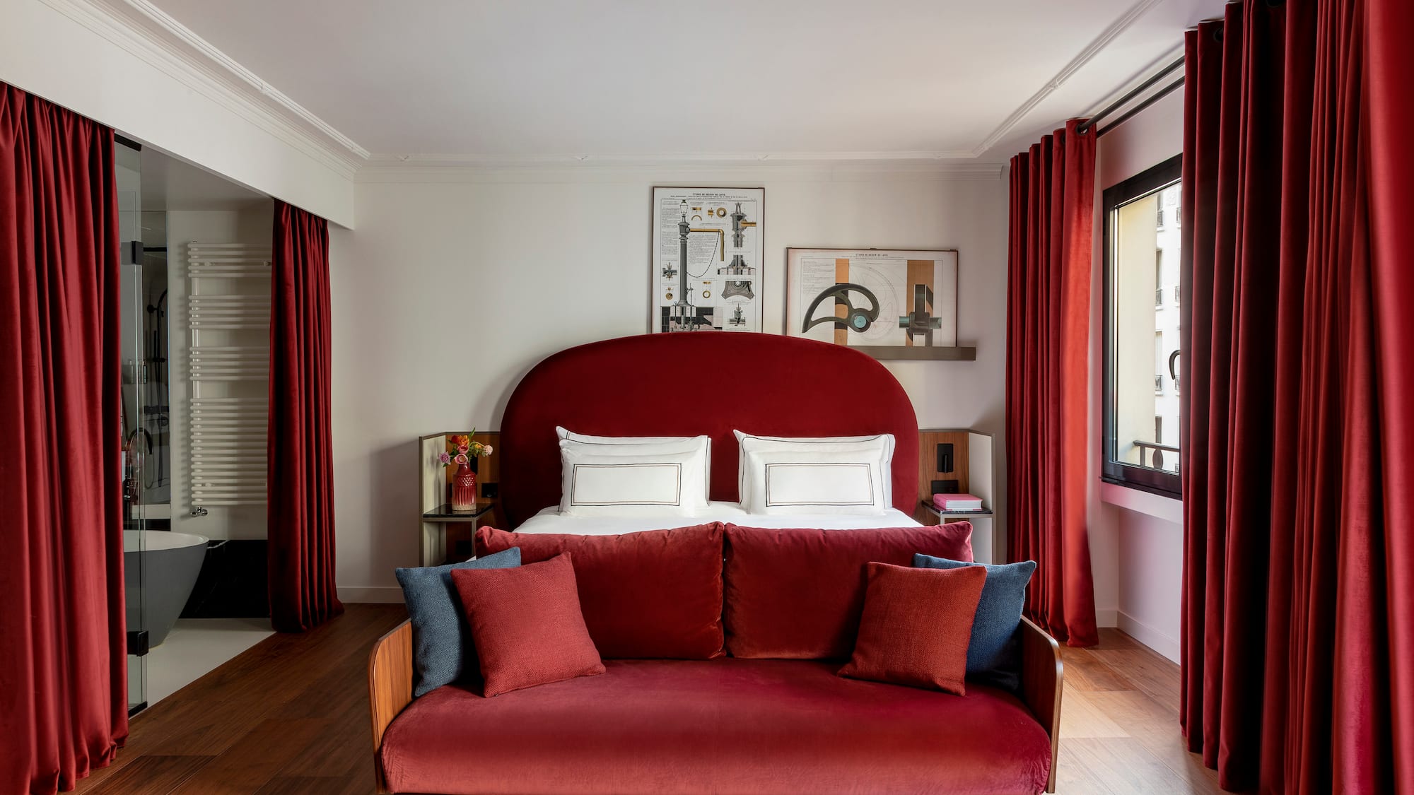 a bed with pillows in a room