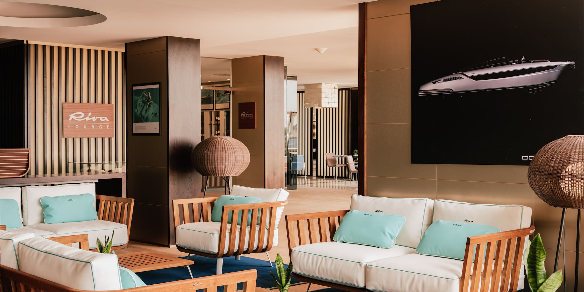 a room with white furniture and a poster on the wall