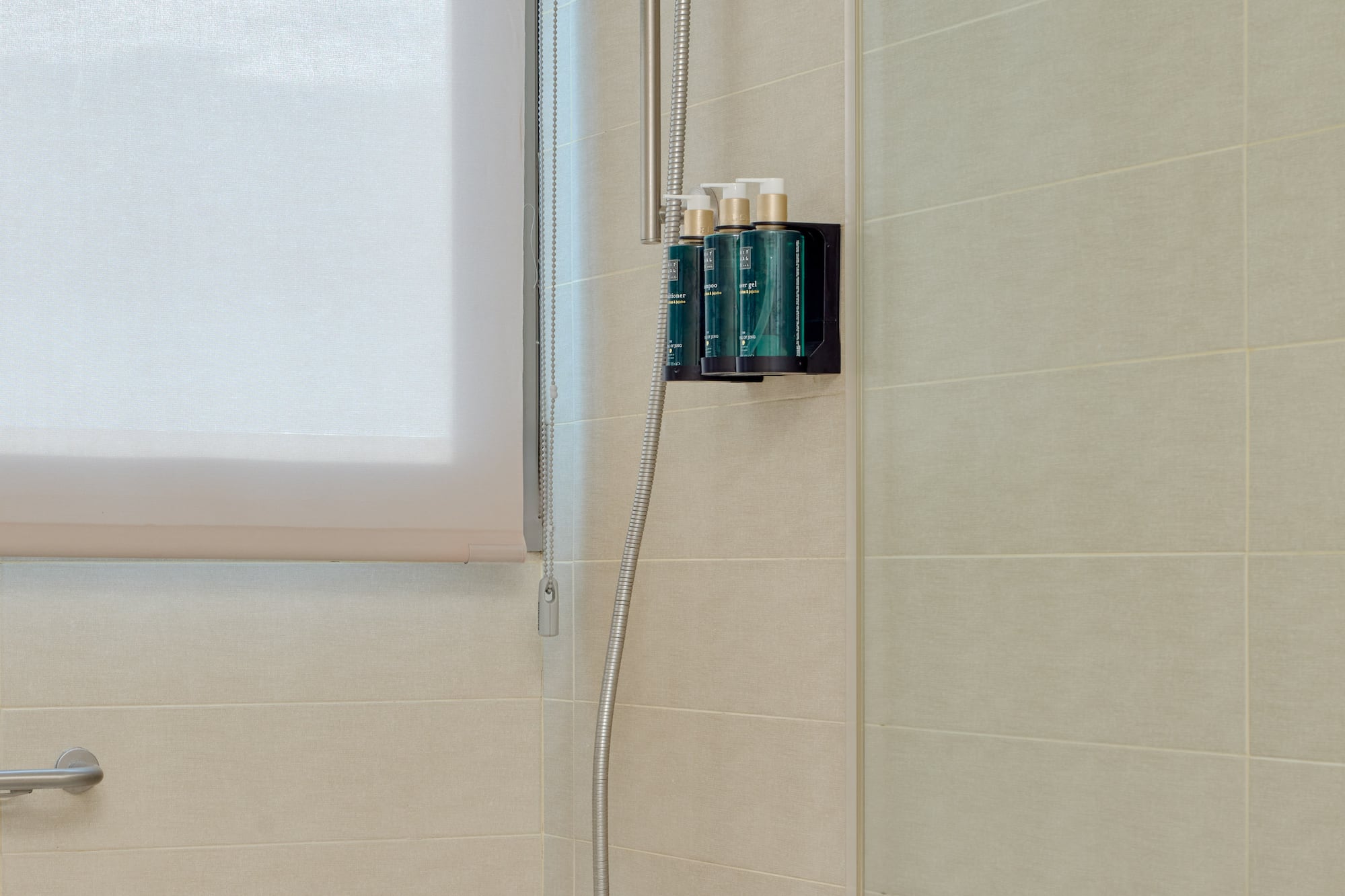 a shower with a tub and shower head
