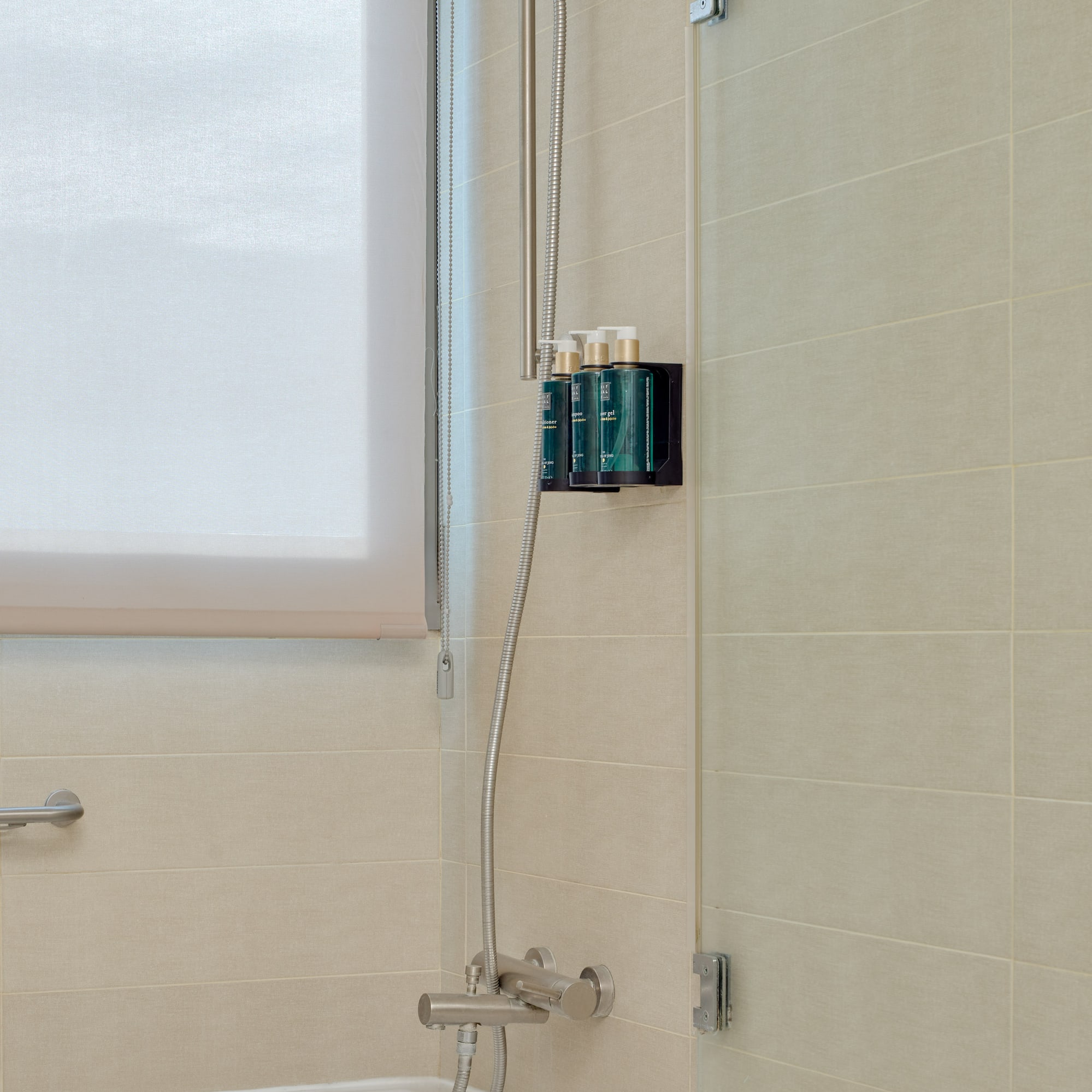 a shower with a tub and shower head