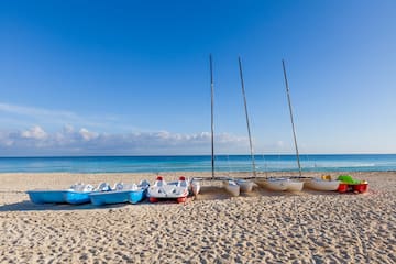 a group of boats on a beach