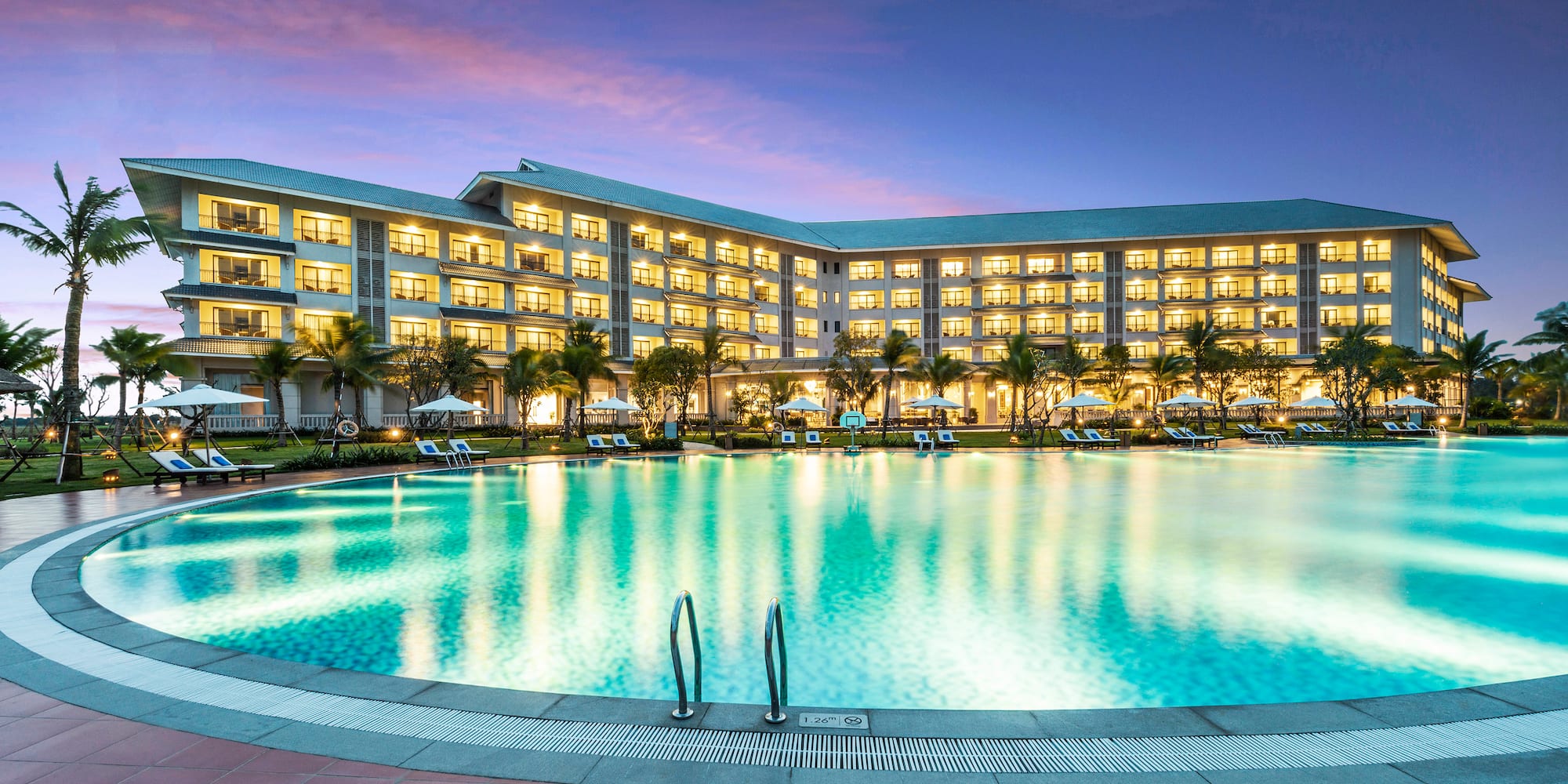 a large hotel with a pool