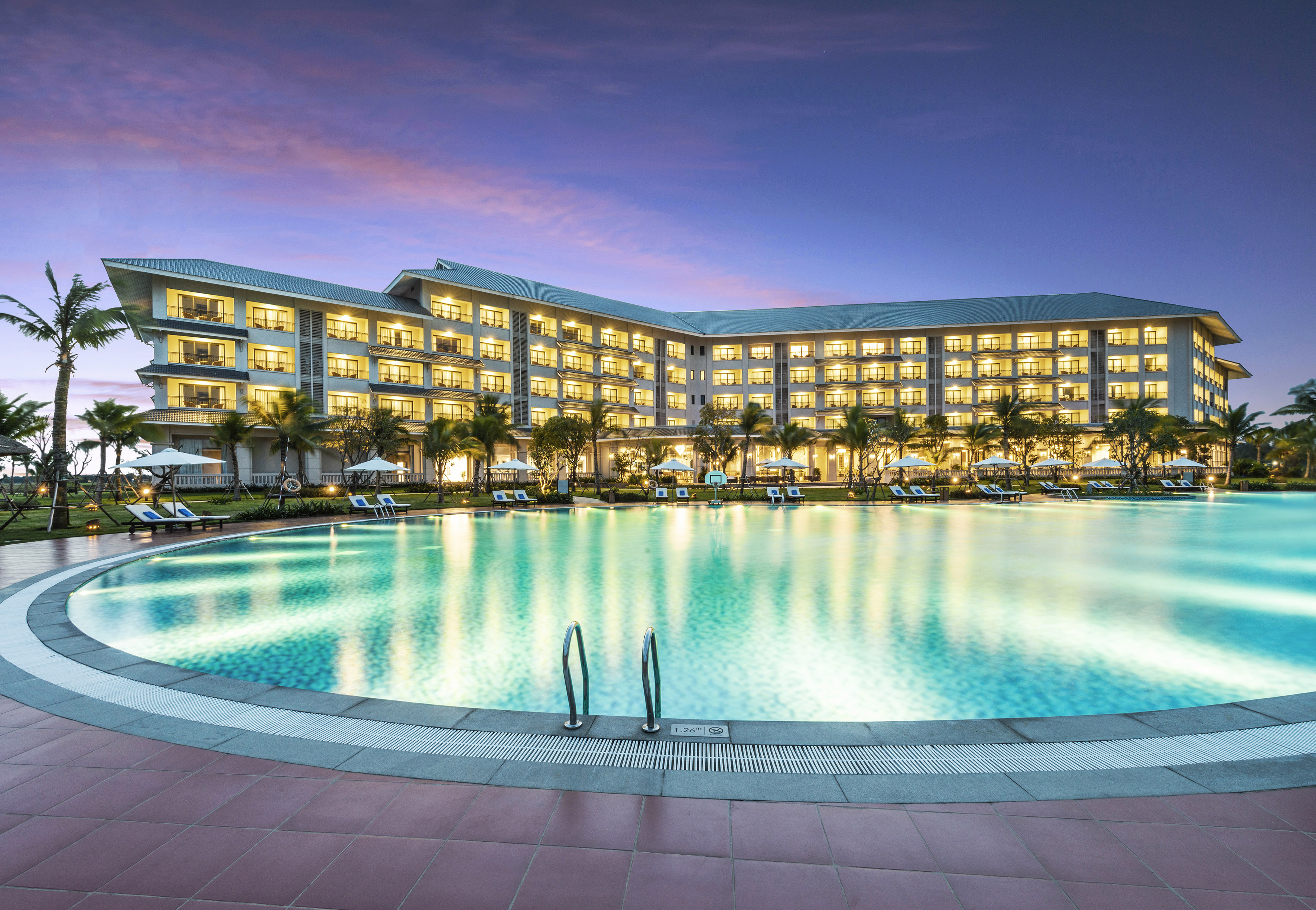 a large hotel with a pool