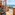 Balcony overlooking ocean and resort pool, with outdoor seating.