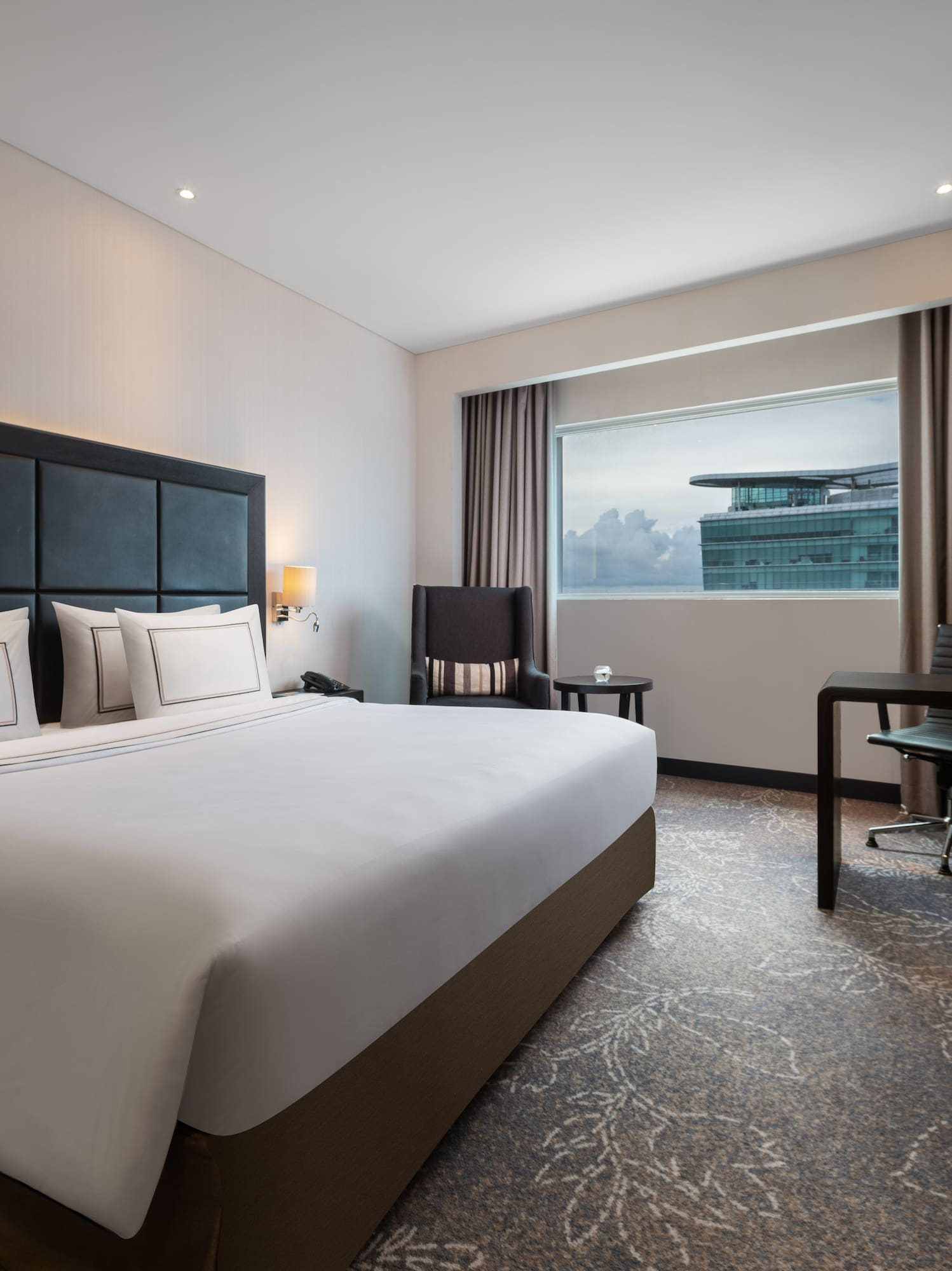 a room with a bed and a desk