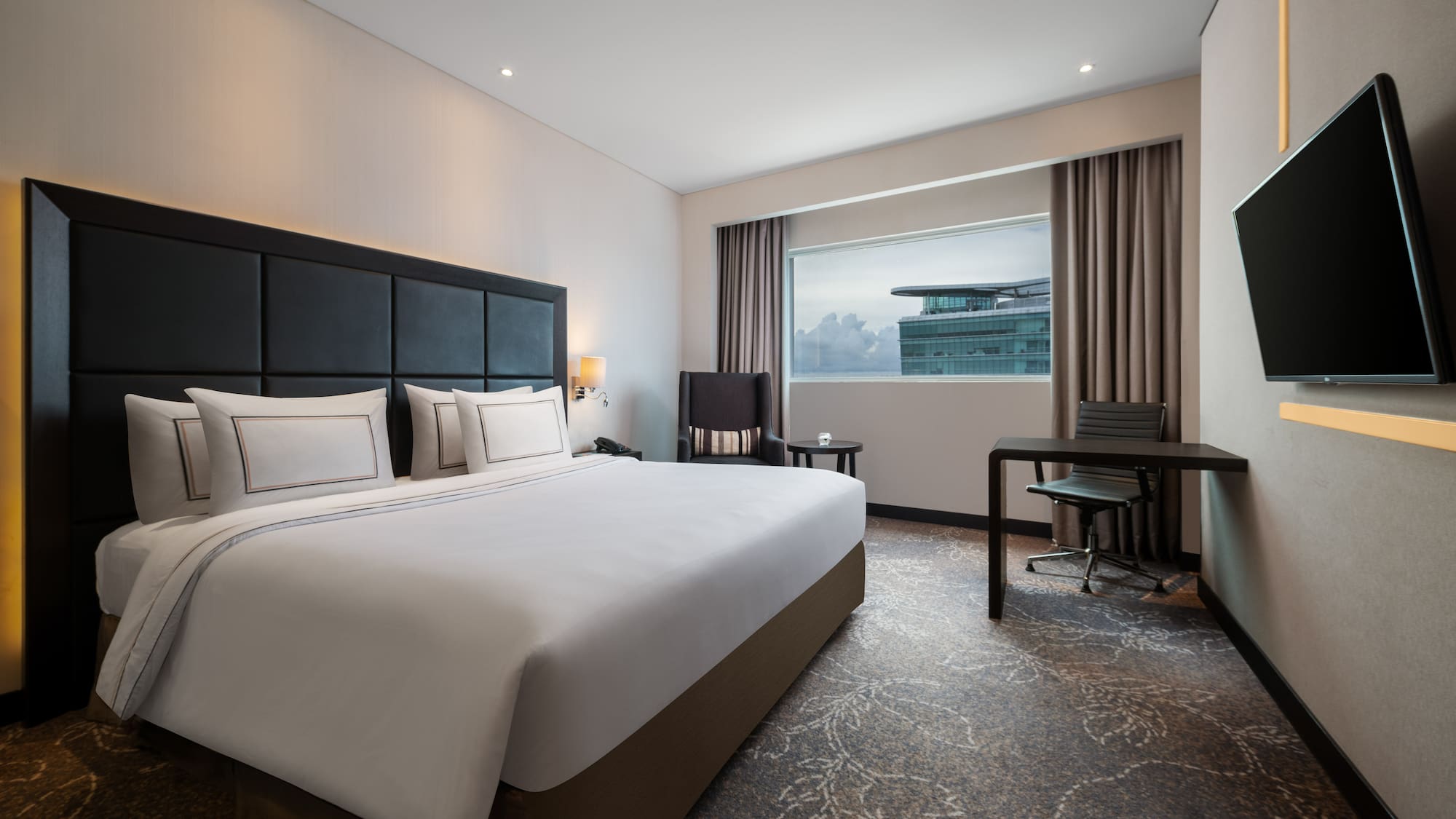 a room with a bed and a desk