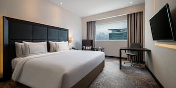 a room with a bed and a desk