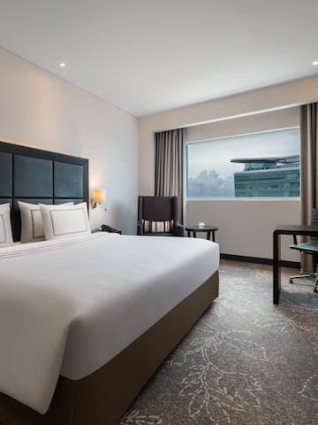 a room with a bed and a desk