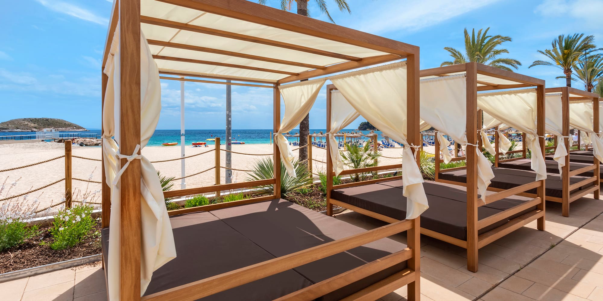 a group of beds on a beach