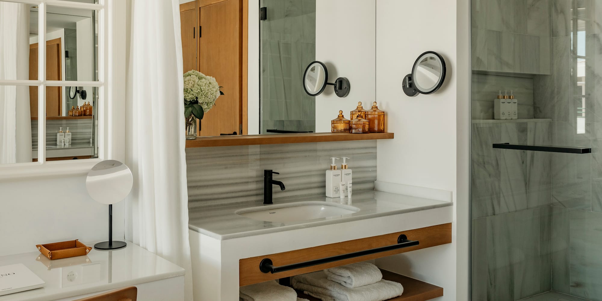 a bathroom with a sink and mirror