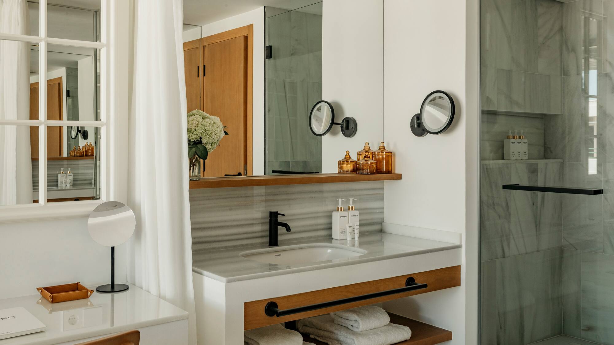 a bathroom with a sink and mirror