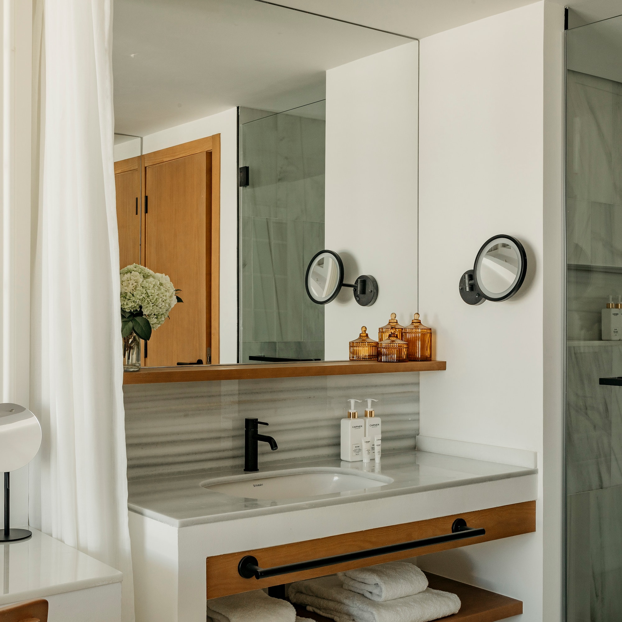 a bathroom with a sink and mirror