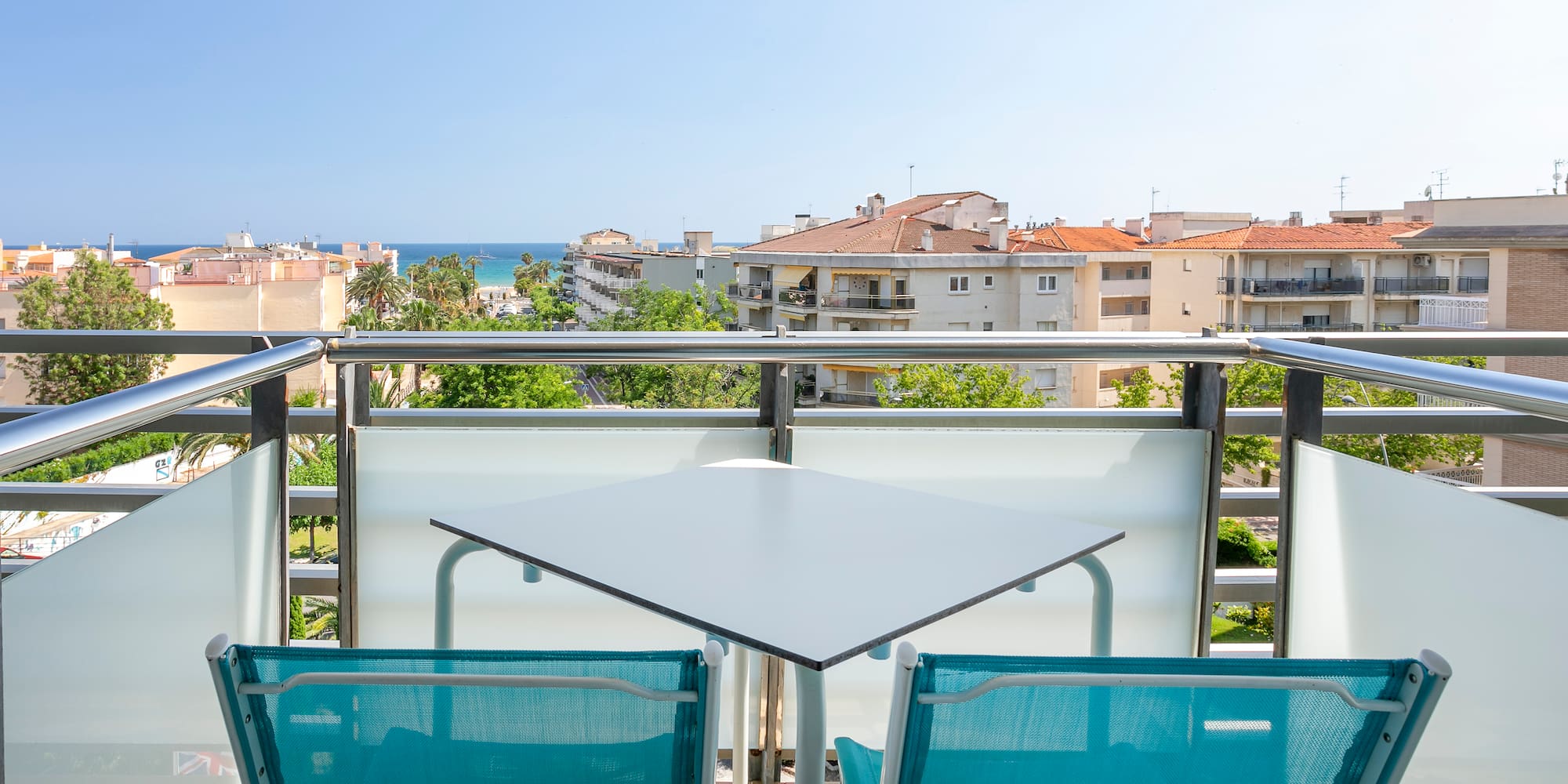a table and chairs on a balcony