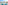 Balcony with table, chairs, coastal city, and ocean view.